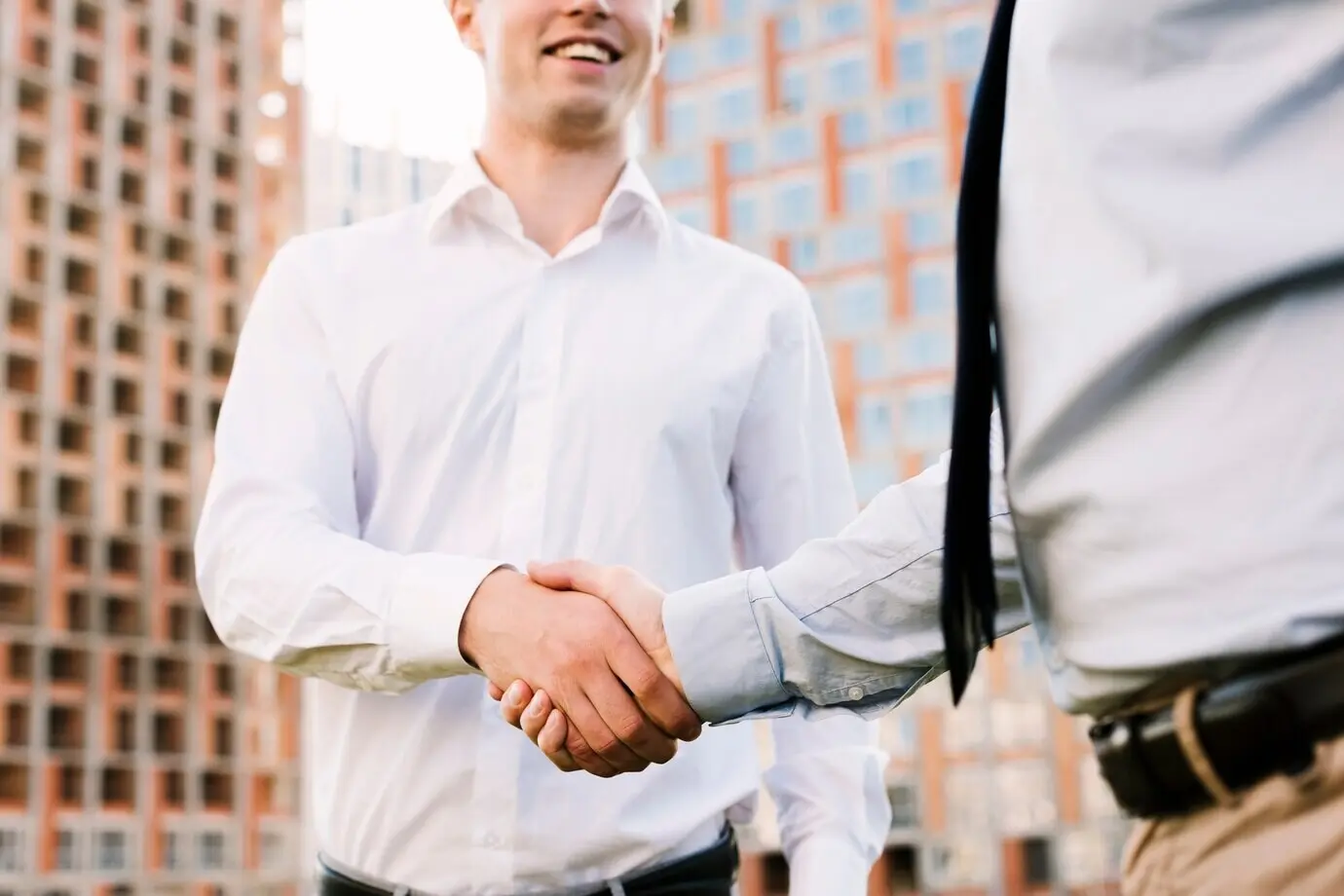 Close-up of men shaking hands